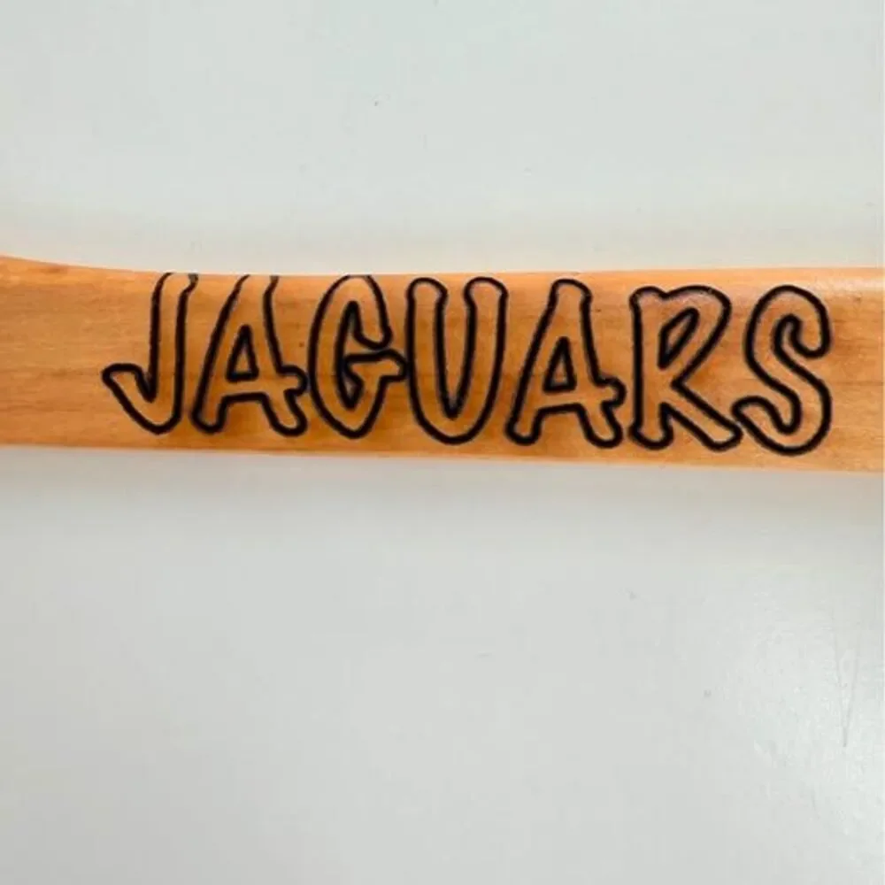 5 custom wood hangers with Jacksonville Jaguars branding.